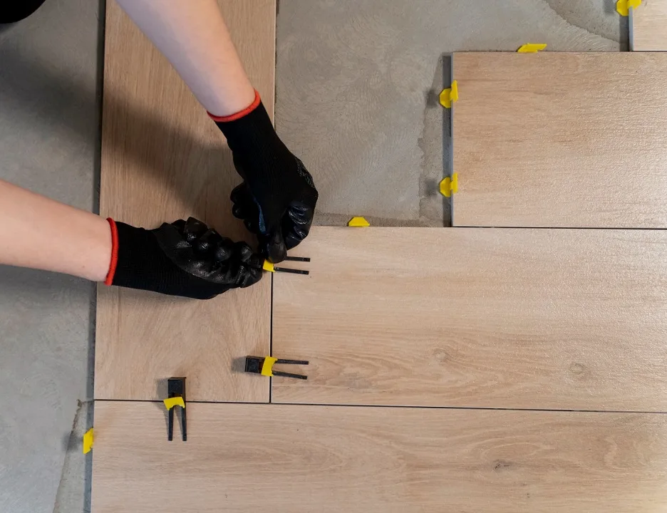 Anchorage painters team installing lay floor tiles